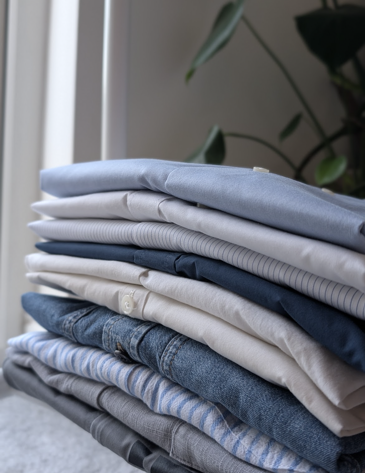 A stack of perfectly folded and ironed shirts